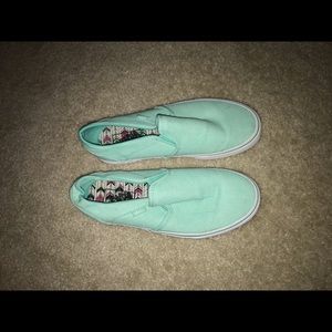 Slip-on cyan-colored vans